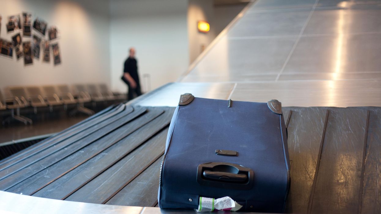 A suitcase on a luggage carousel.