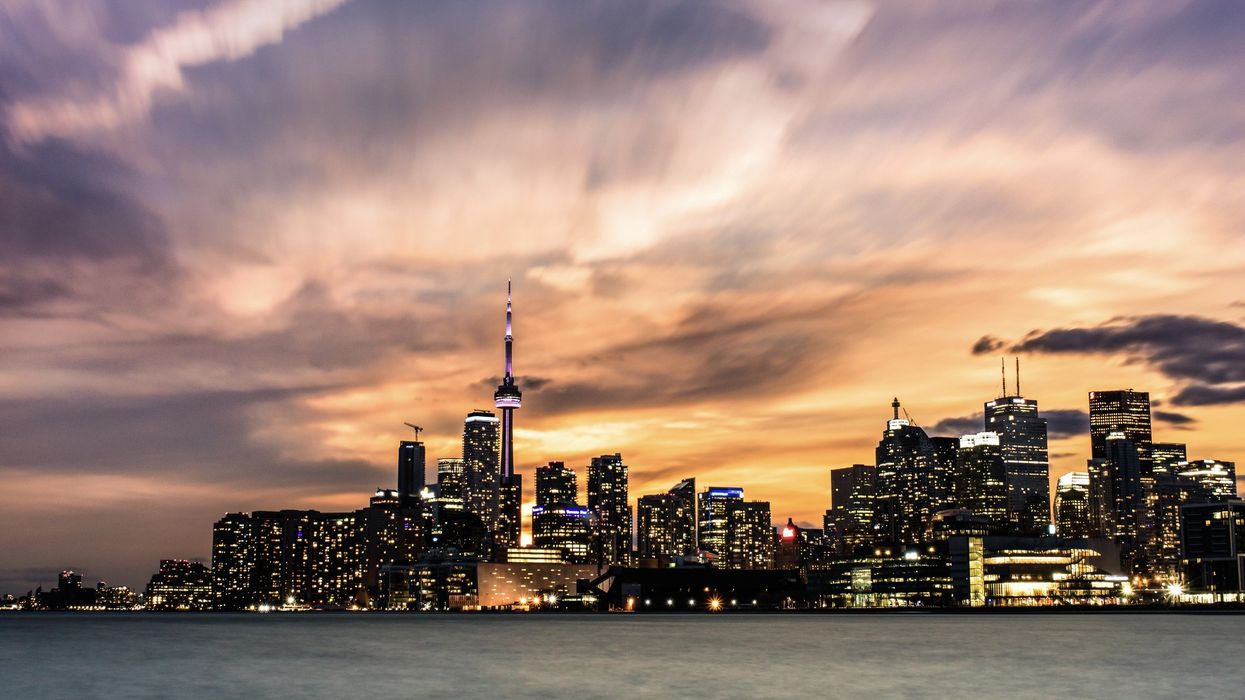 A sunset over Toronto with the CN Tower in the background.