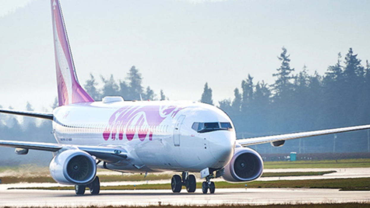 A Swoop plane on a runway.