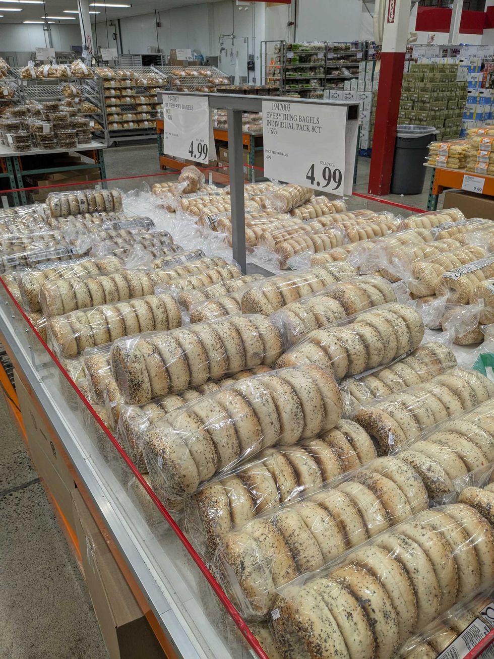 A table full of packages of bagels at Costco