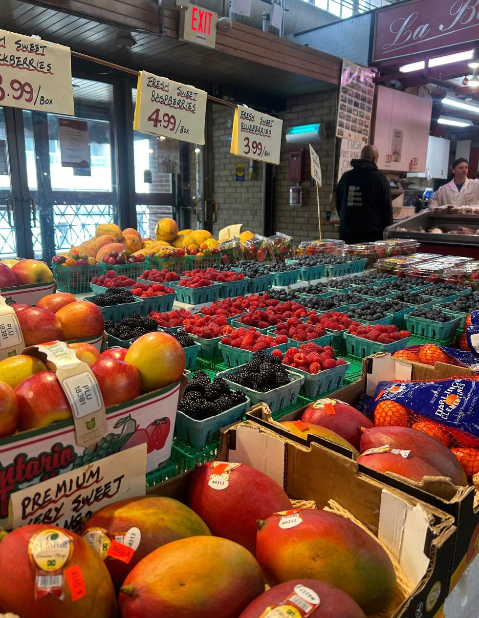 A table of fresh fruit at a market.