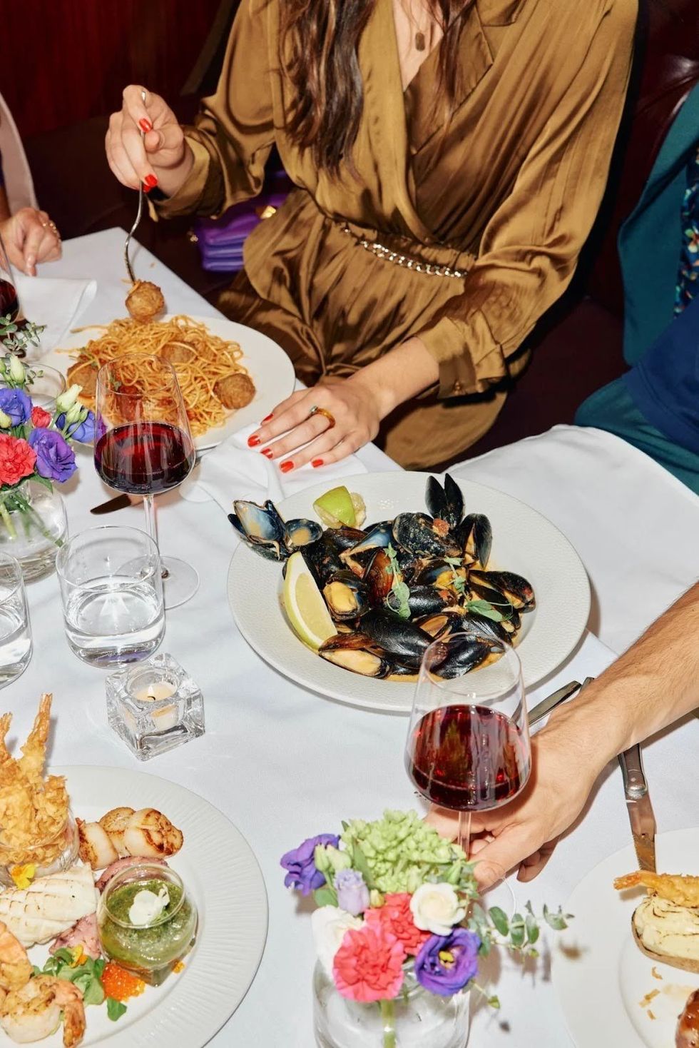 A table spread with decadent dishes from Ar\u00f4me.