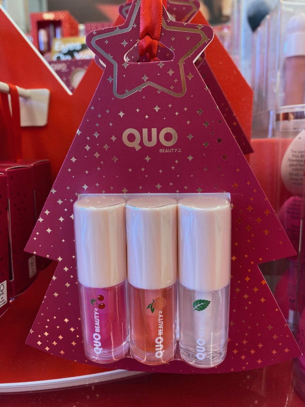 A three-pack of QUO Beauty lip oils at Shoppers Drug Mart.