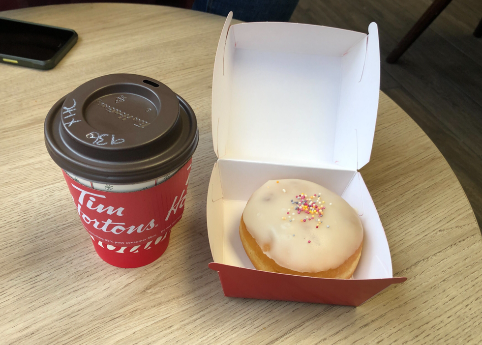 A Tim Hortons donut and hot chocolate.