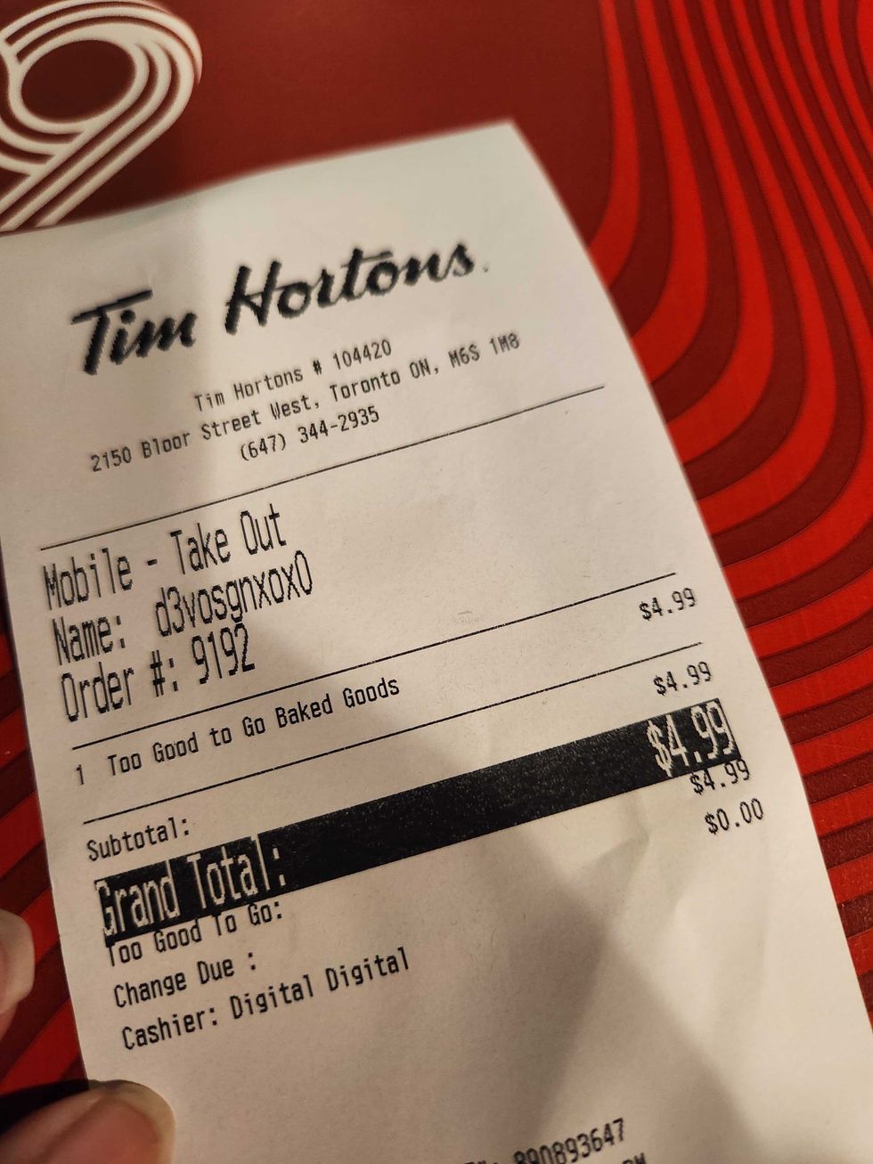 A Tim Hortons receipt for $4.99.
