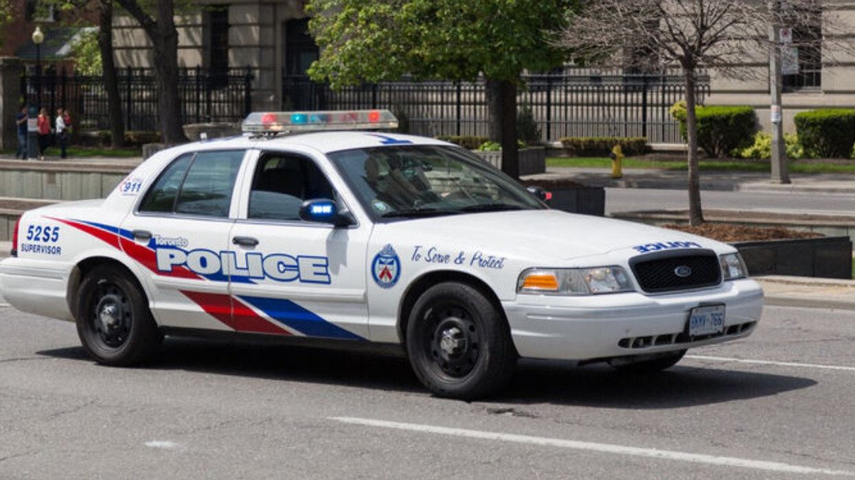 A Toronto police car on a road.