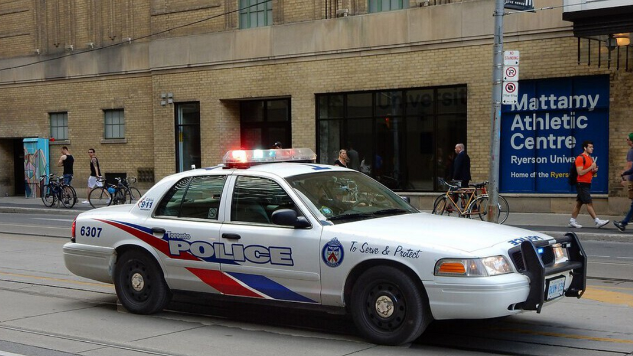A Toronto Police car with its lights activated.