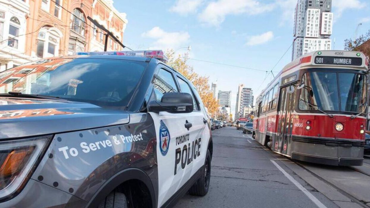 A Toronto Police cruiser next to a TTC vehicle.