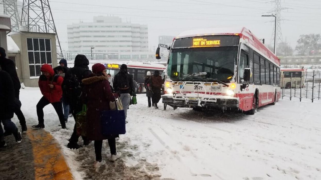 A TTC bus on a snowy day.