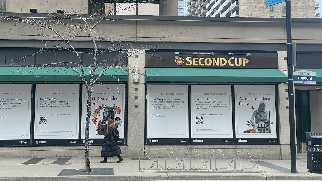 A vacant storefront on Yonge Street showcasing the HerStory campaign.