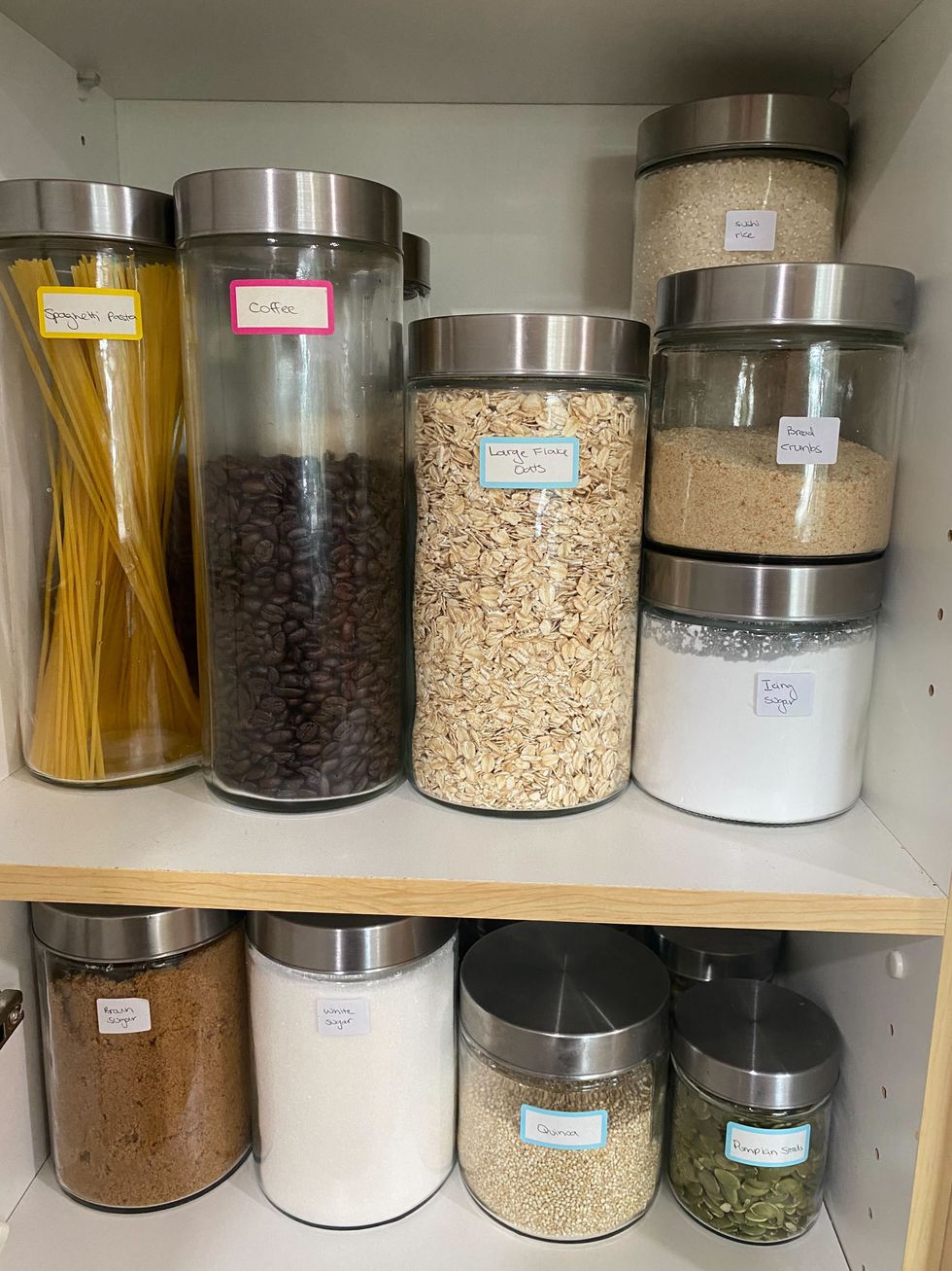 A variety of glass jars with food in them.