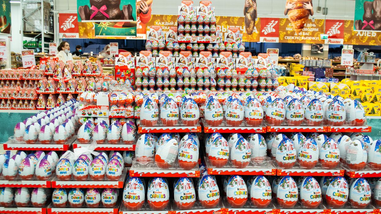 A variety of Kinder chocolates in a store.