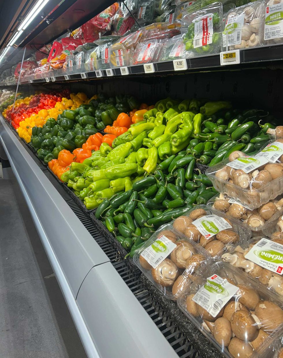 A vegetable aisle at a grocery store.