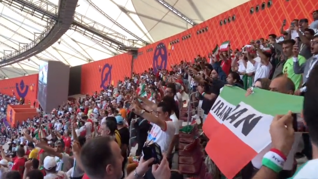 A video shows the crowd shouting and booing as Iran's national anthem played before the team's World Cup game.