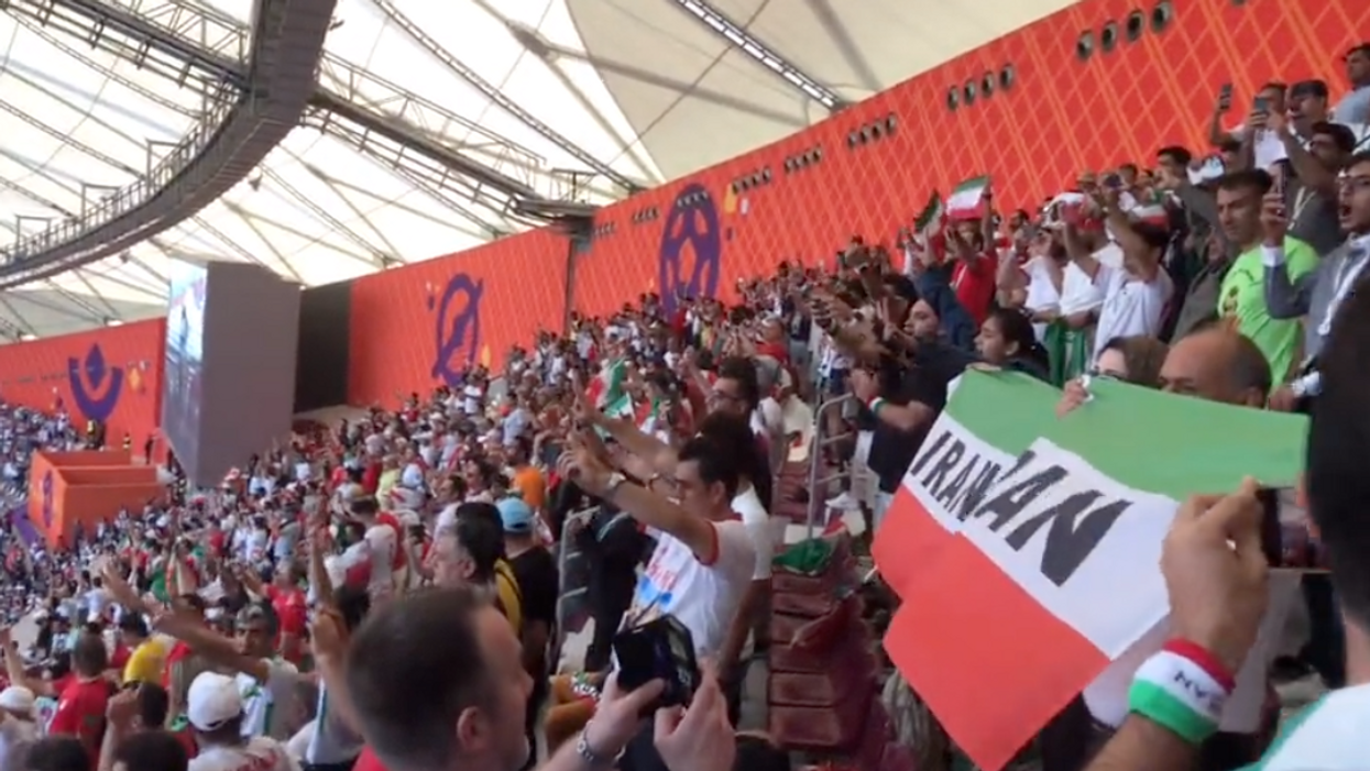 A video shows the crowd shouting and booing as Iran's national anthem played before the team's World Cup game.