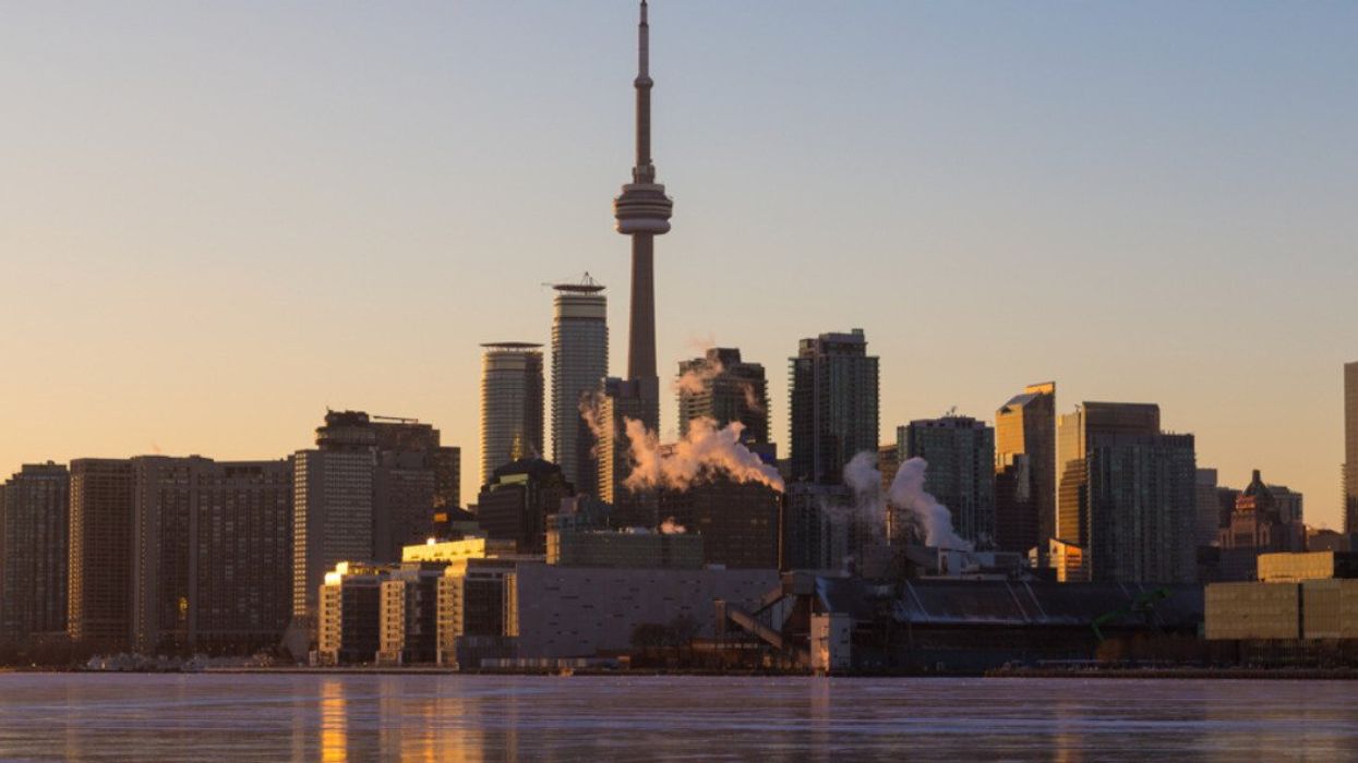 A view of the Toronto skyline during the winter months with ice on Lake Ontario.