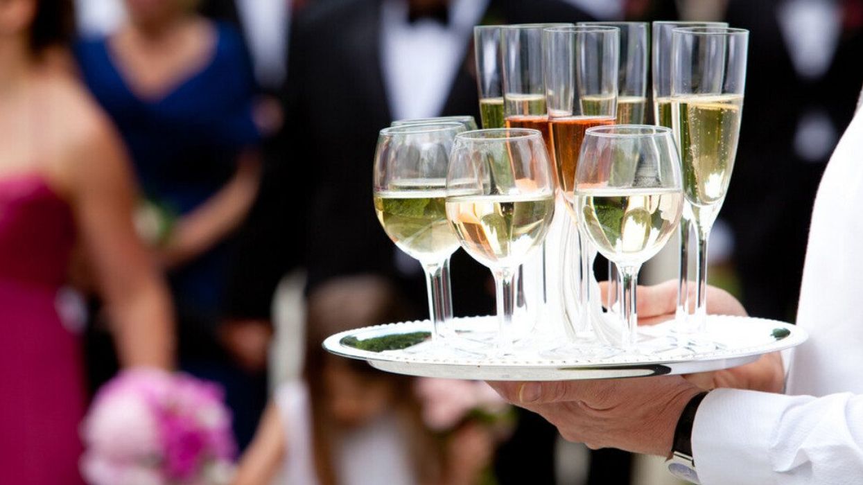 A waiter serving drinks at a wedding.