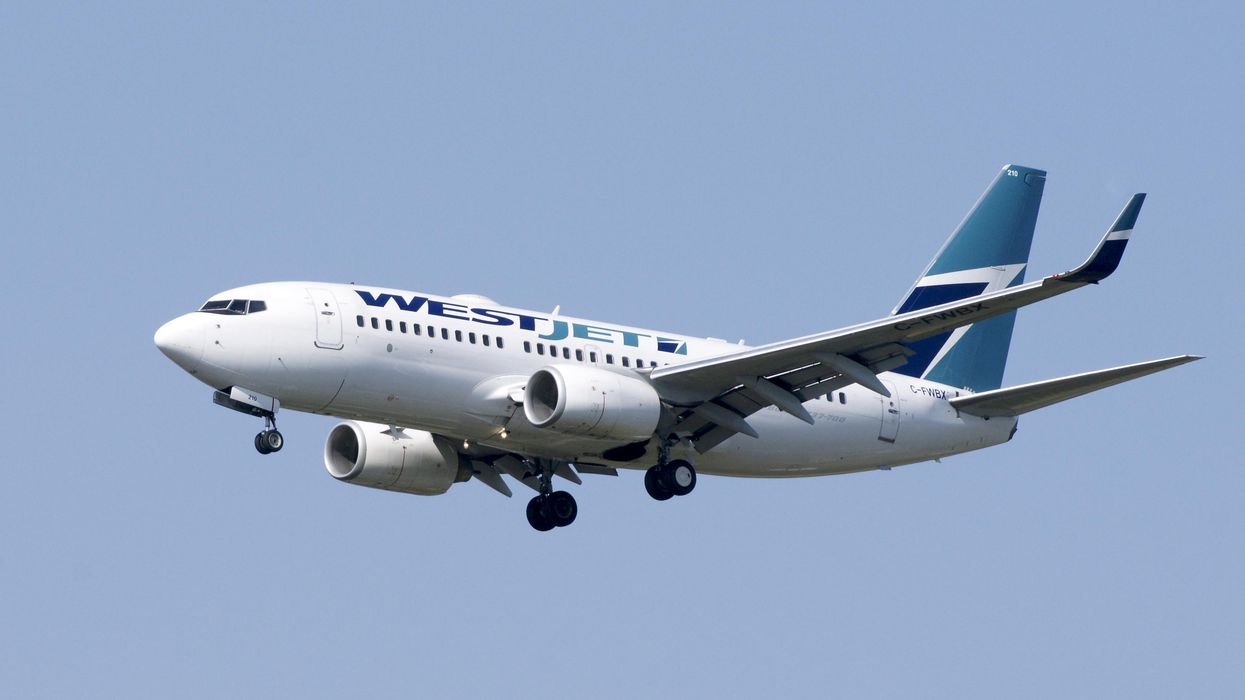 A WestJet plane in the air.