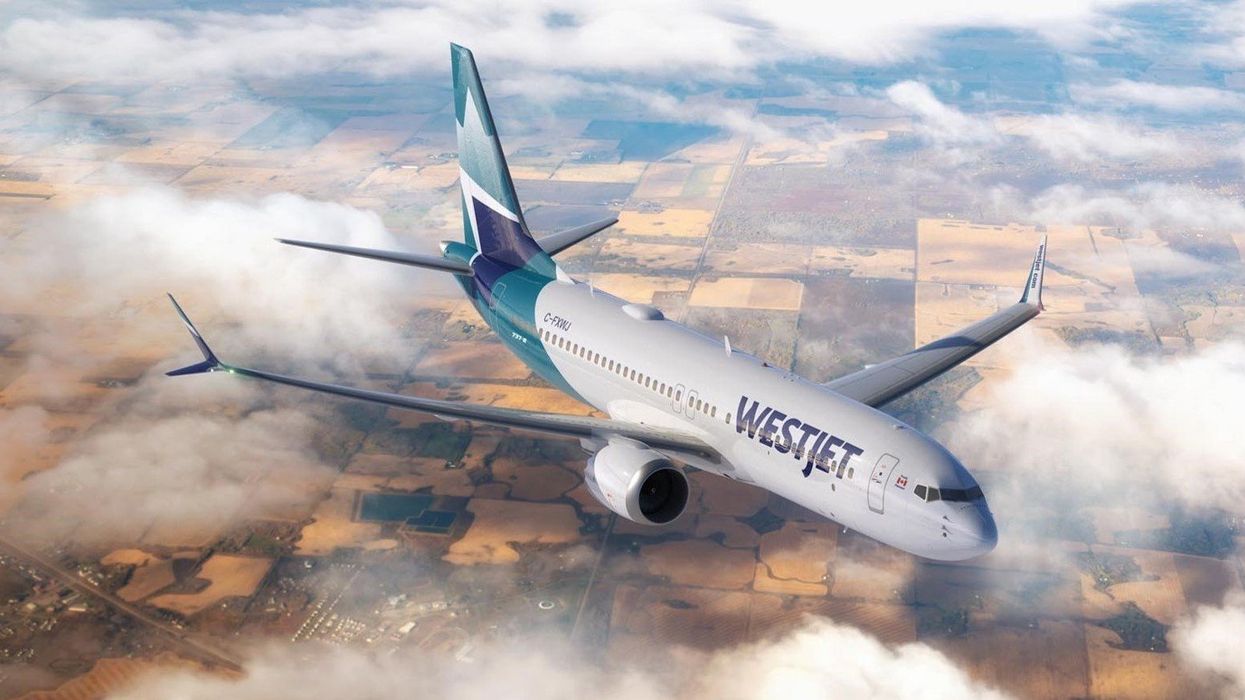 A WestJet plane in the sky.