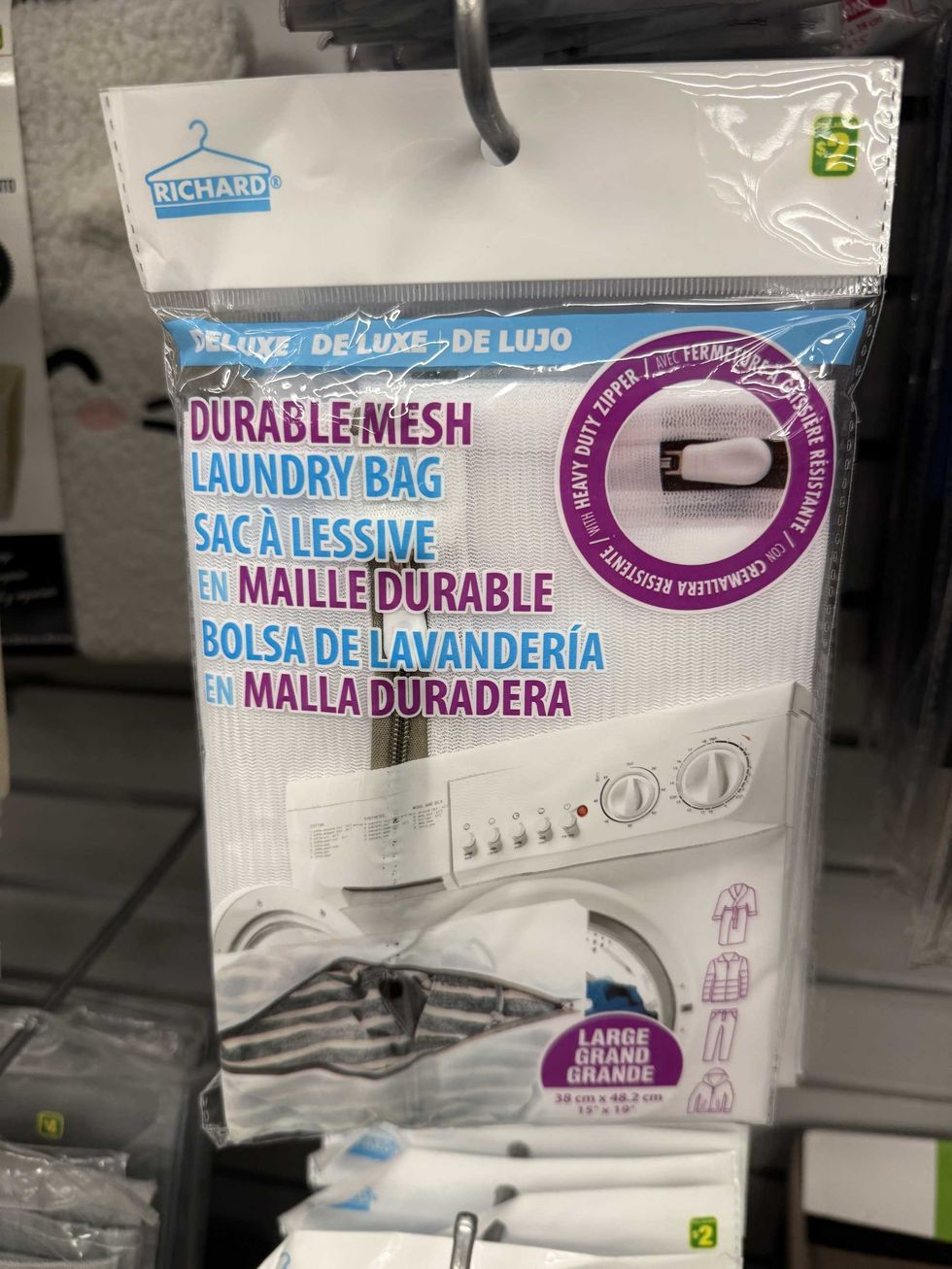 A white bag with a zipper on it and a label that says durable mesh laundry bag on it.
