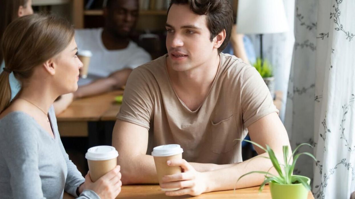 A woman and a man on a coffee date.