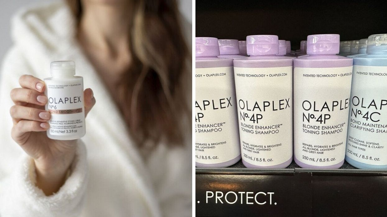 A woman holding a bottle of Olaplex. Olaplex shampoo on display.