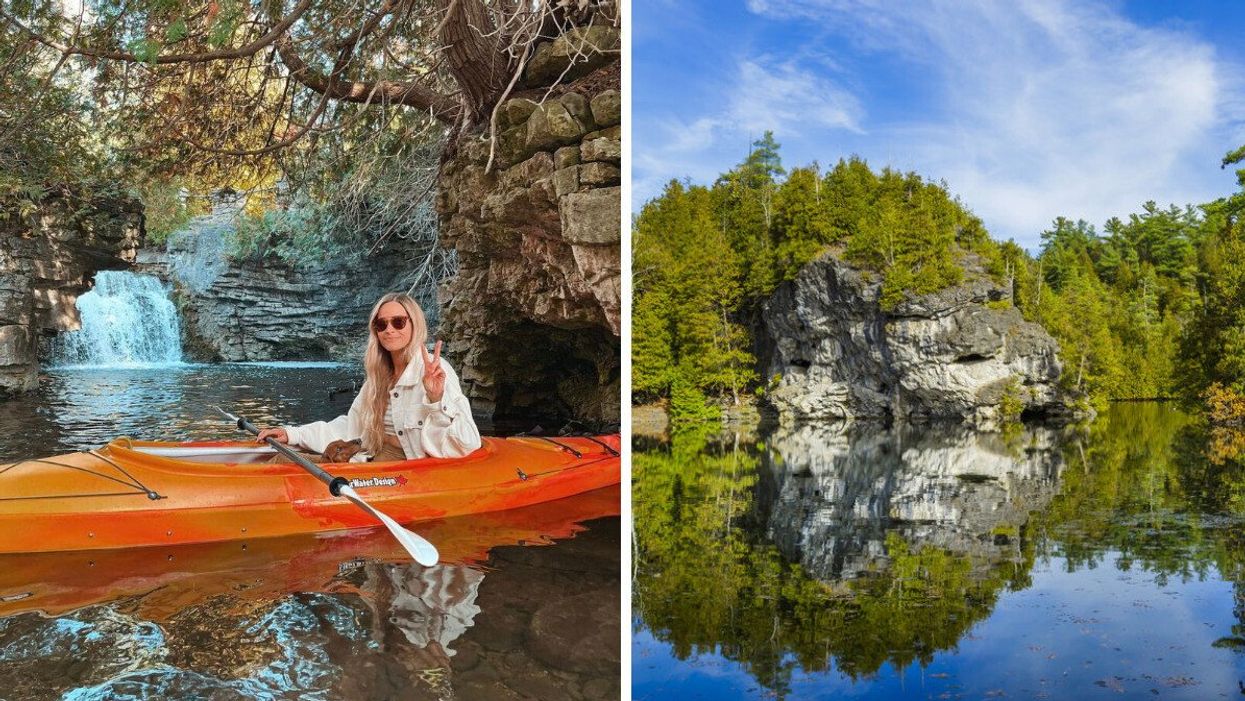A woman in an orange kayak. Right: Cliffs covered in trees.