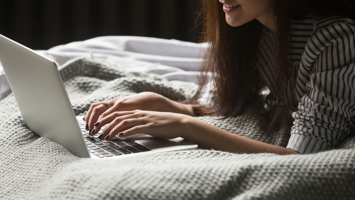 A woman in bed on her laptop.