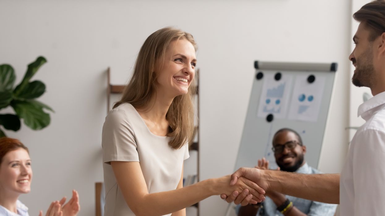 A woman receiving a promotion.