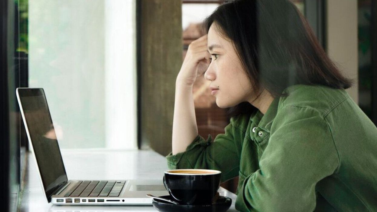 A woman researching therapists online.