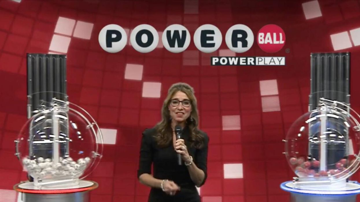 A woman running the Powerball lottery draw.