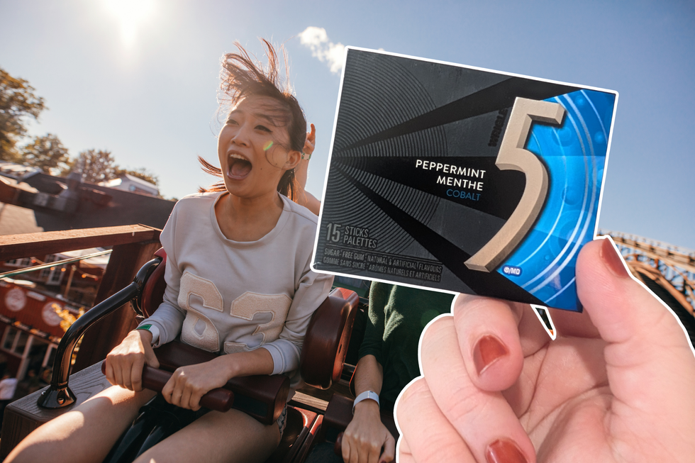 A woman screaming while riding a roller coaster on a sunny day. A hand holding a packet of Cobalt flavour 5 Gum is over the top.