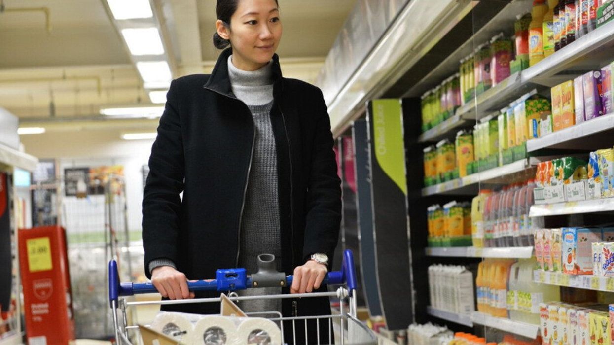 A woman shopping for groceries at Walmart.