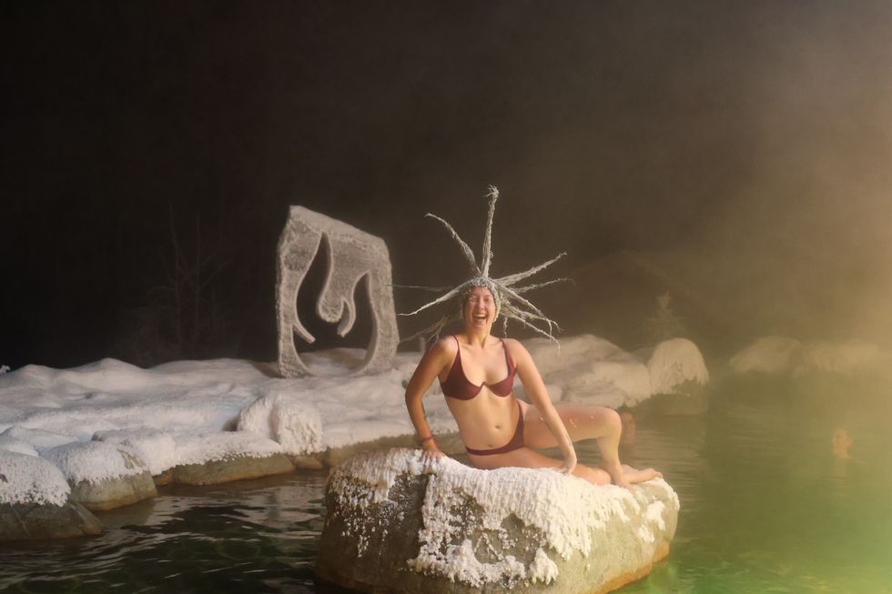 A woman shows off spikey, frozen hair.