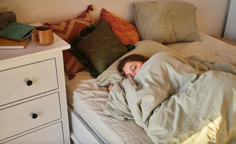 A woman sleeping in bed.