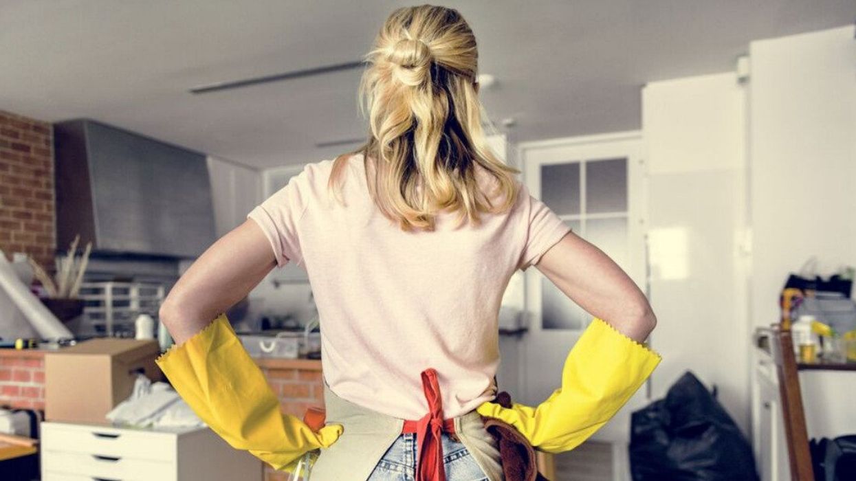 A woman spring cleaning her home.