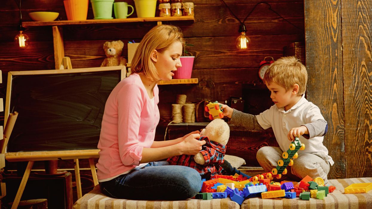 A woman taking care of a child.