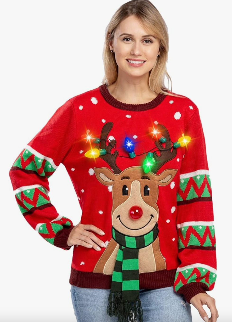 A woman wearing a Christmas sweater with a reindeer on it.