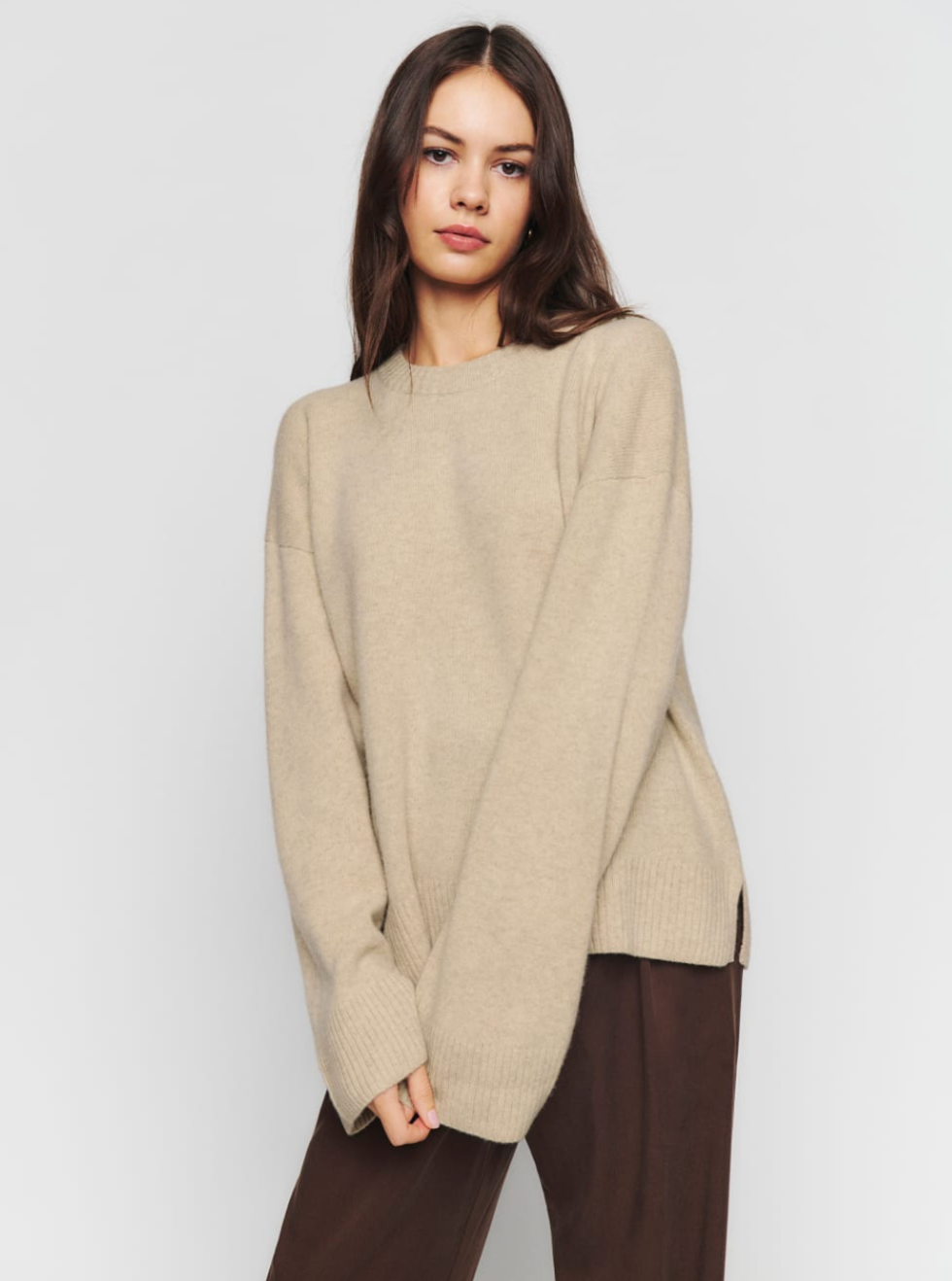 A woman wearing the Enda Regenerative Wool Sweater.