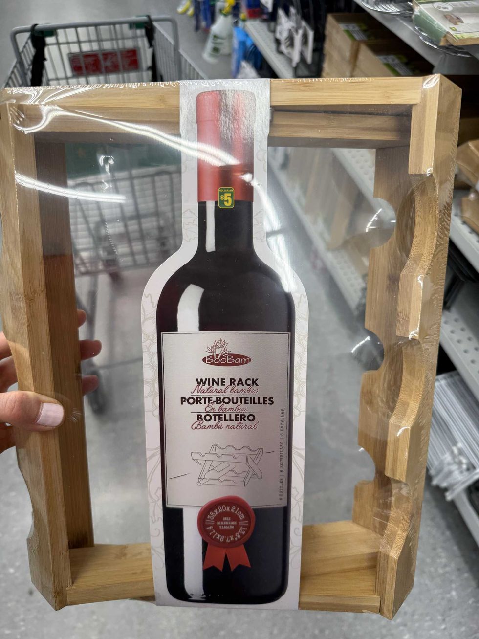 A wooden rack with a photo of a wine bottle on it.