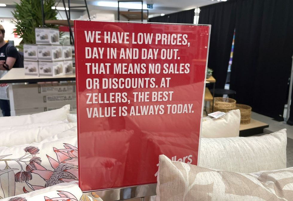 A Zellers sign advertising their low prices.