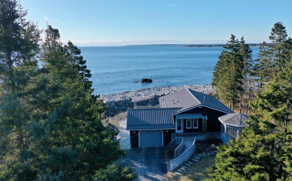 aerial view from the front of the bungalow with the ocean behind it
