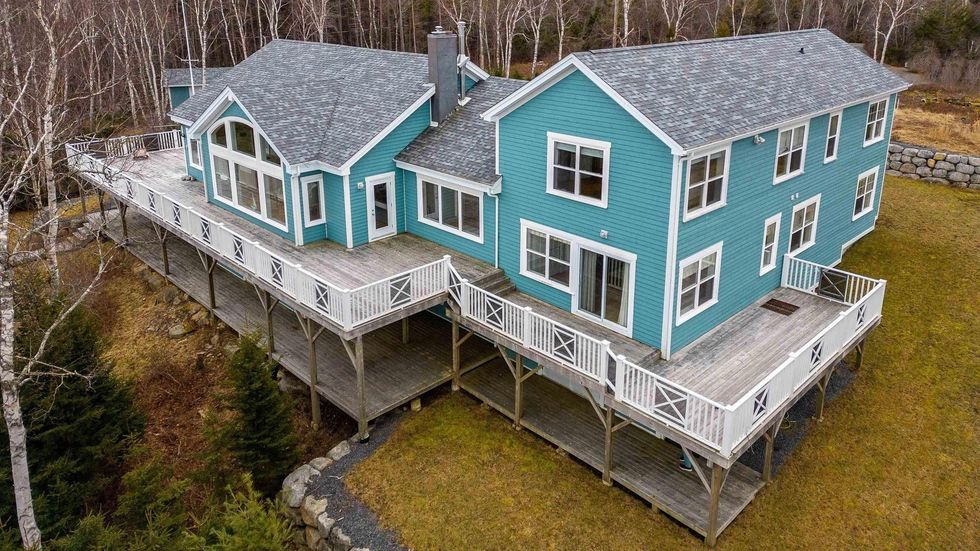 Aerial view of the brightly coloured house for sale in Nova Scotia.