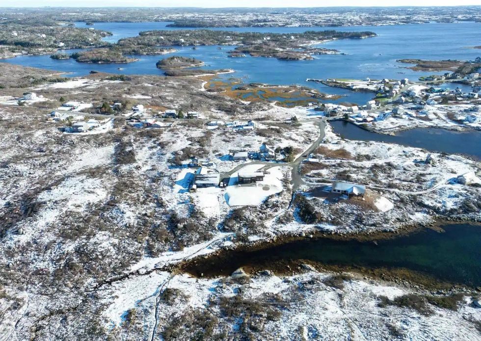 aerial view of the house and surrounding area during the winter after a snowfall