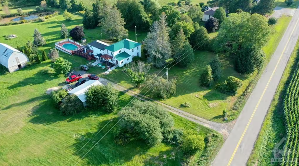 Aerial view of the property and its pond.