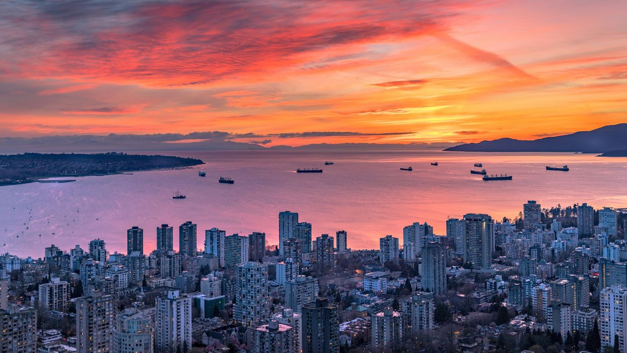 Aerial view of Vancouver's English Bay at sunset (illustrative).