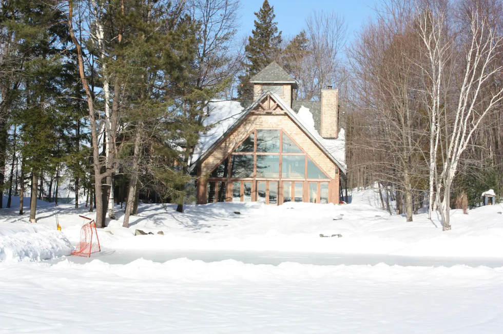 Airbnb with an ice rink and snow.