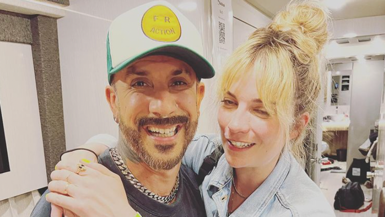 AJ McLean and Annie Murphy hugging.