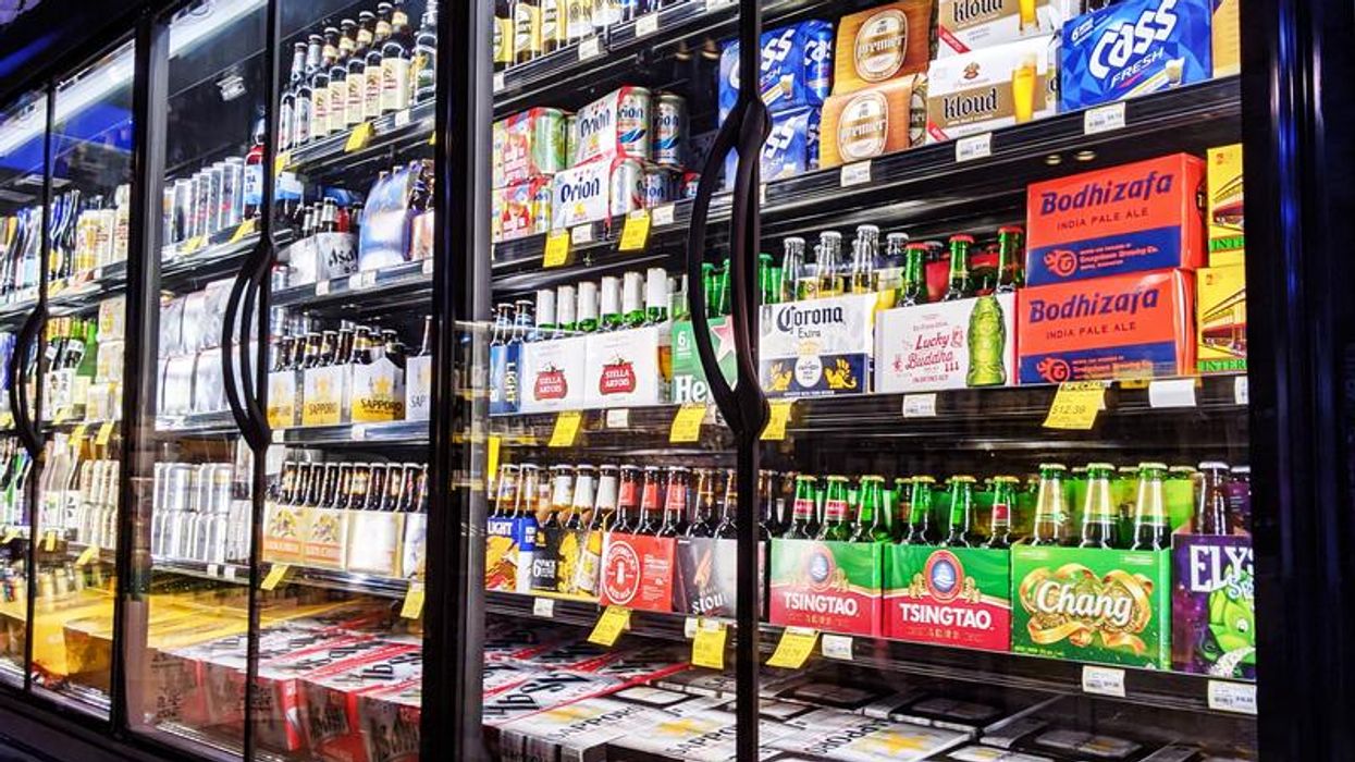 Alcoholic beverages within a fridge.