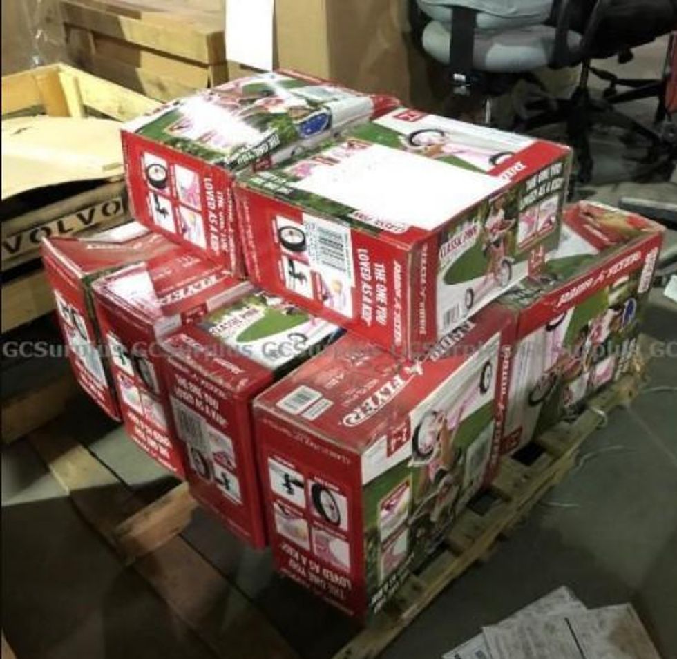 All of the tricycles in their boxes.